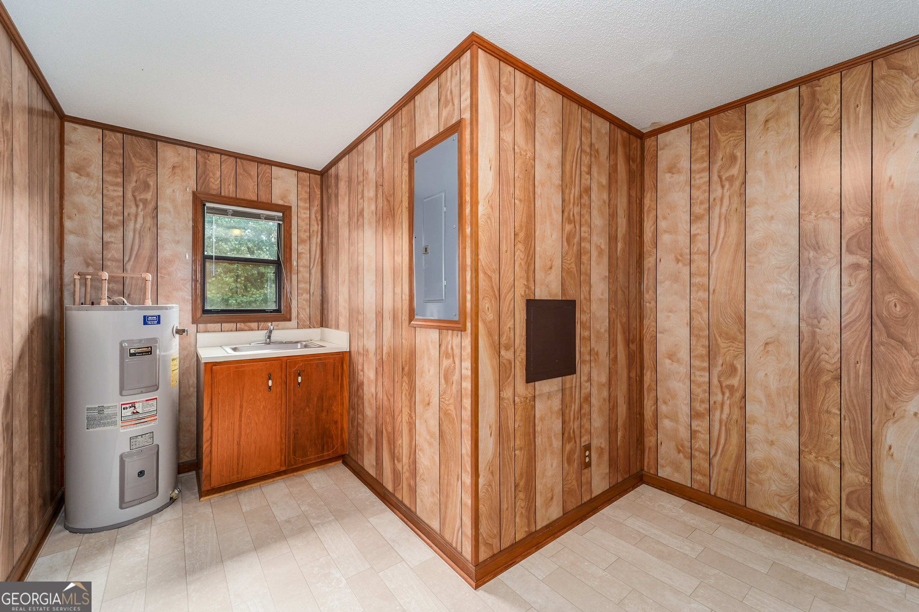603 Cumberland Road Hortense, GA 31543 - Photo 25 of 26 a view of a kitchen with kitchen island a refrigerator wooden floor and window