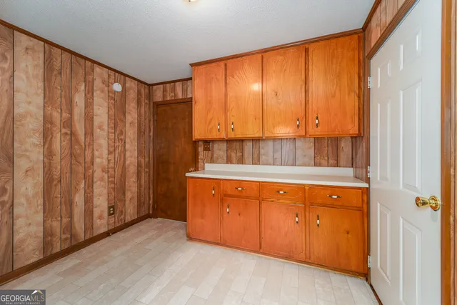 a bathroom with a sink a mirror and a shower curtain