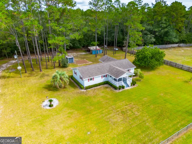 a view of a swimming pool with a patio and yard