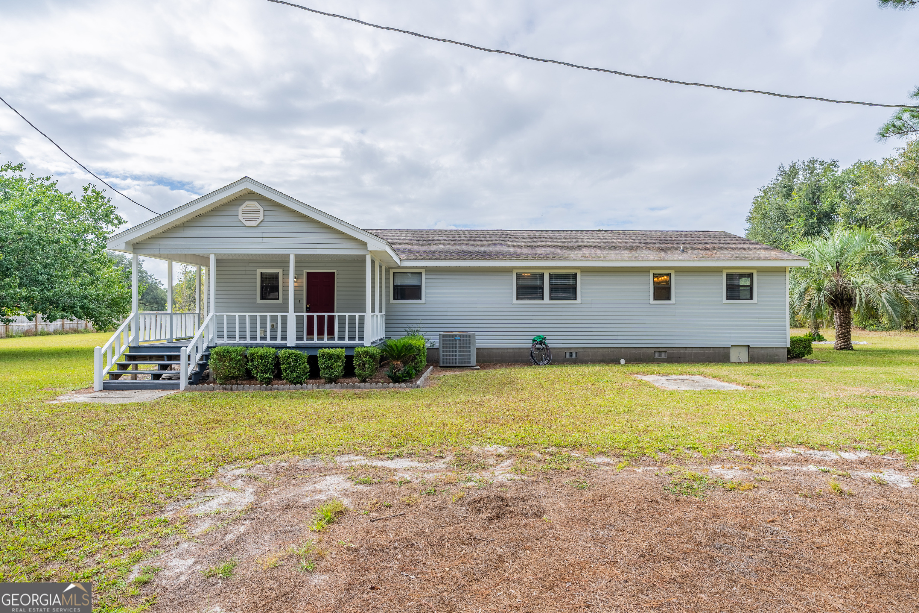 603 Cumberland Road Hortense, GA 31543 - Photo 6 of 26 a view of a house with a swimming pool
