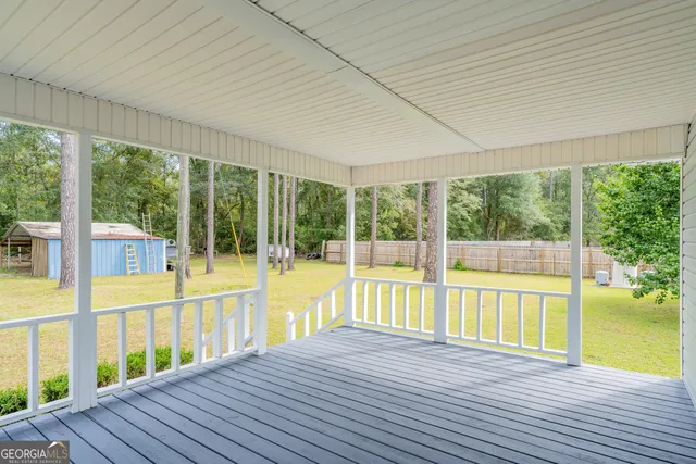 a view of a swimming pool and an outdoor space