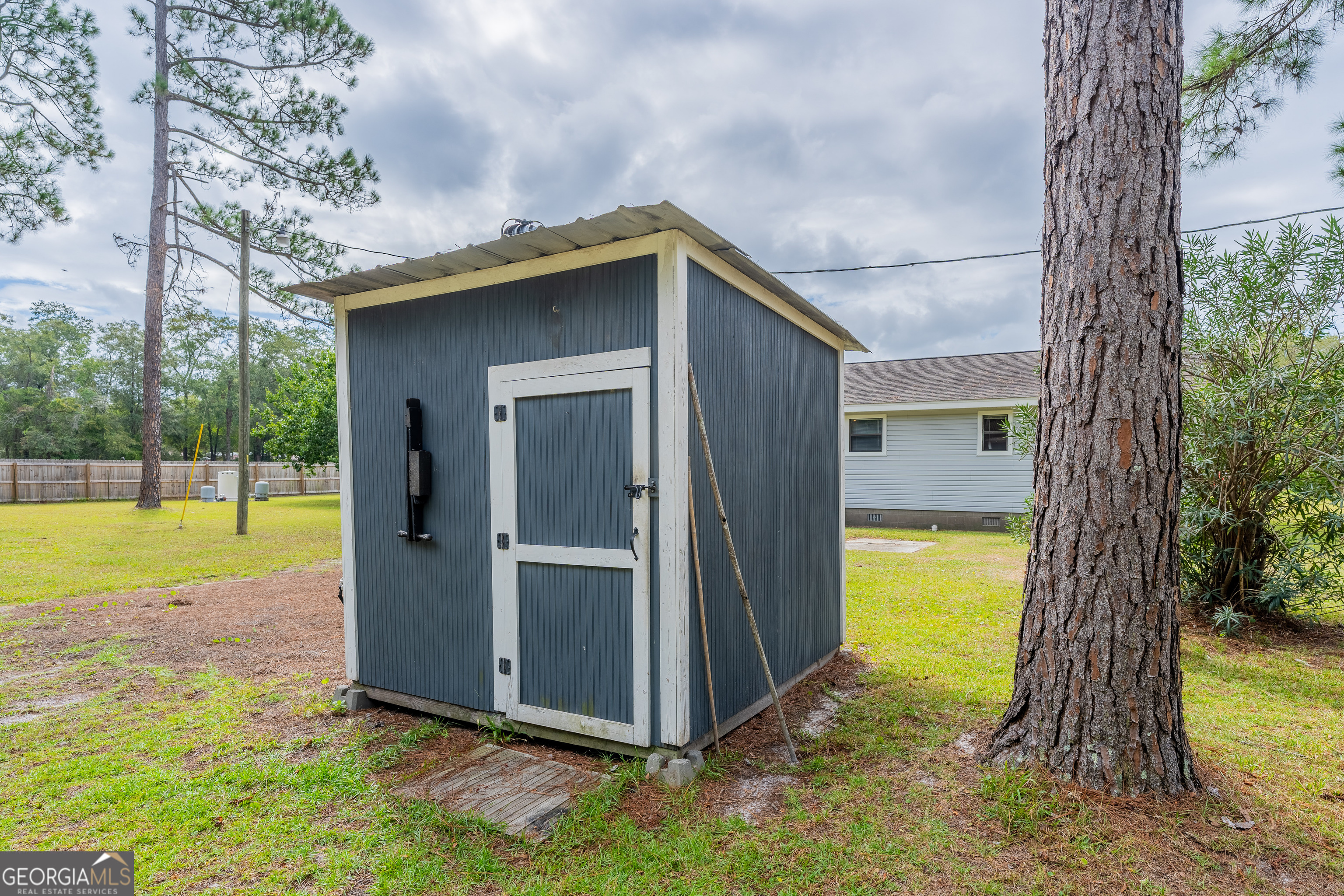 603 Cumberland Road Hortense, GA 31543 - Photo 9 of 26 a view of backyard with swimming pool and yard