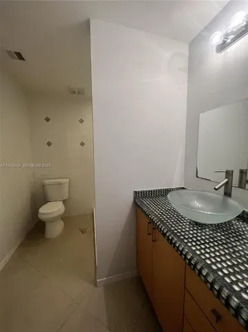 a stove top oven sitting inside of a kitchen