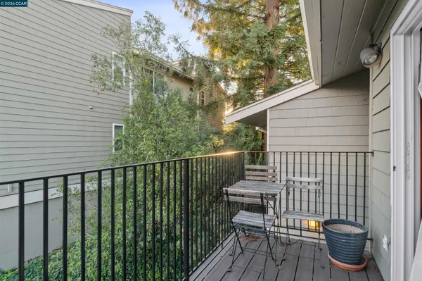 a view of a balcony with wooden floor