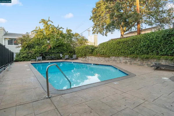 a view of a swimming pool with a yard