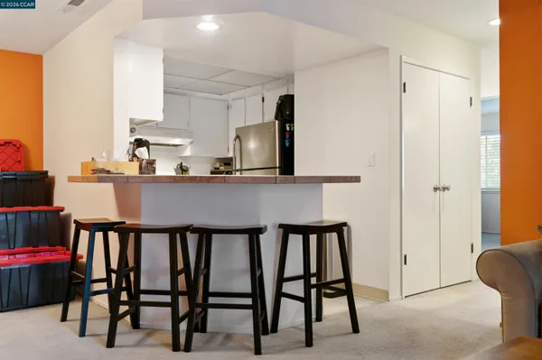a dining room with furniture and window