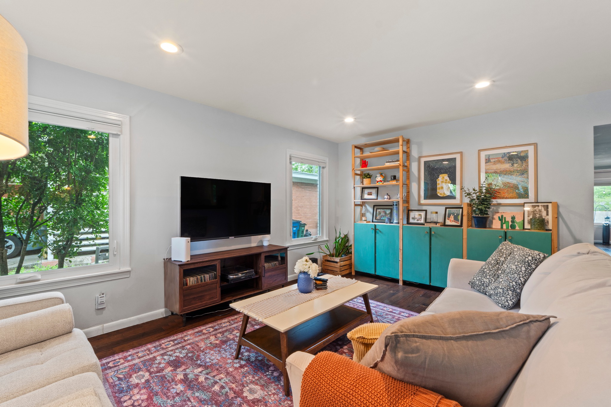 1301 Ridgemont Drive Austin, TX 78723 - Photo 11 of 32 a living room with furniture and a flat screen tv