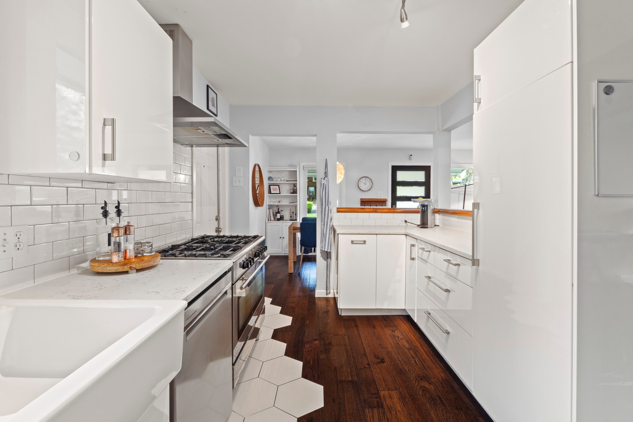 1301 Ridgemont Drive Austin, TX 78723 - Photo 20 of 32 a kitchen with a sink a stove and cabinets
