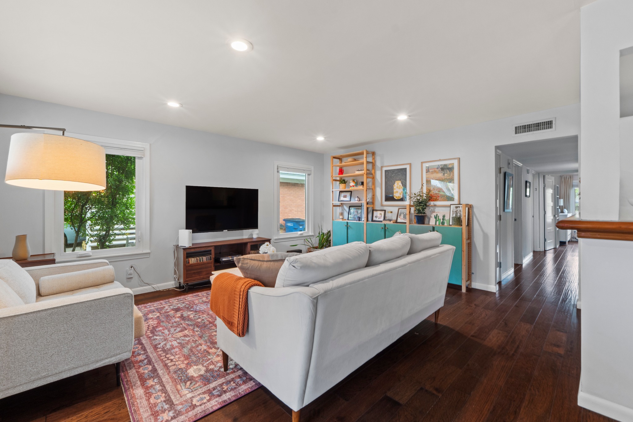 1301 Ridgemont Drive Austin, TX 78723 - Photo 2 of 32 a living room with furniture and a flat screen tv