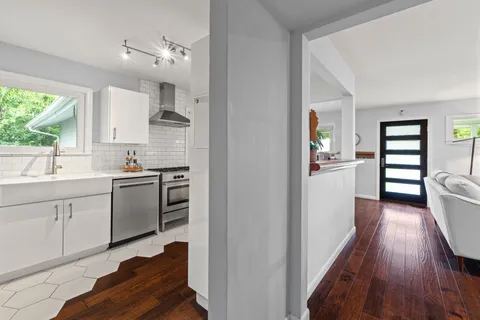 a kitchen with cabinets and appliances