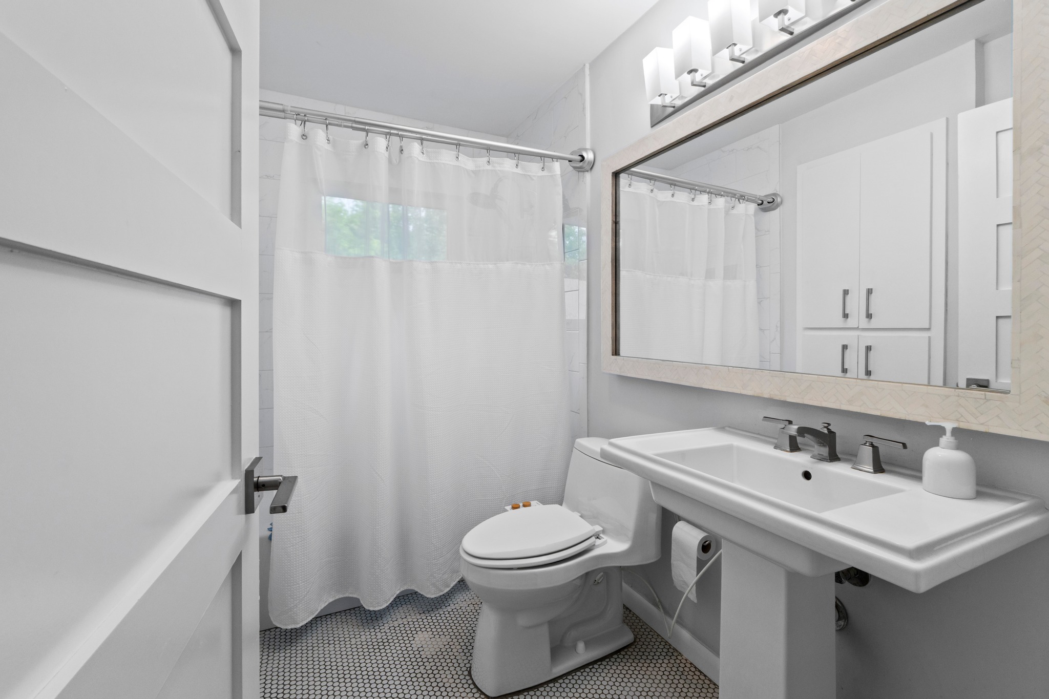 1301 Ridgemont Drive Austin, TX 78723 - Photo 24 of 32 a bathroom with a sink a toilet and shower