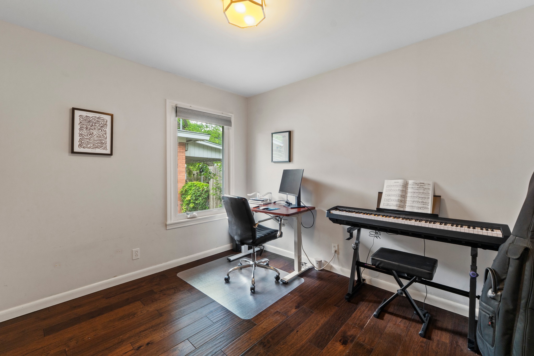 1301 Ridgemont Drive Austin, TX 78723 - Photo 27 of 32 a view of a workspace with furniture and a window