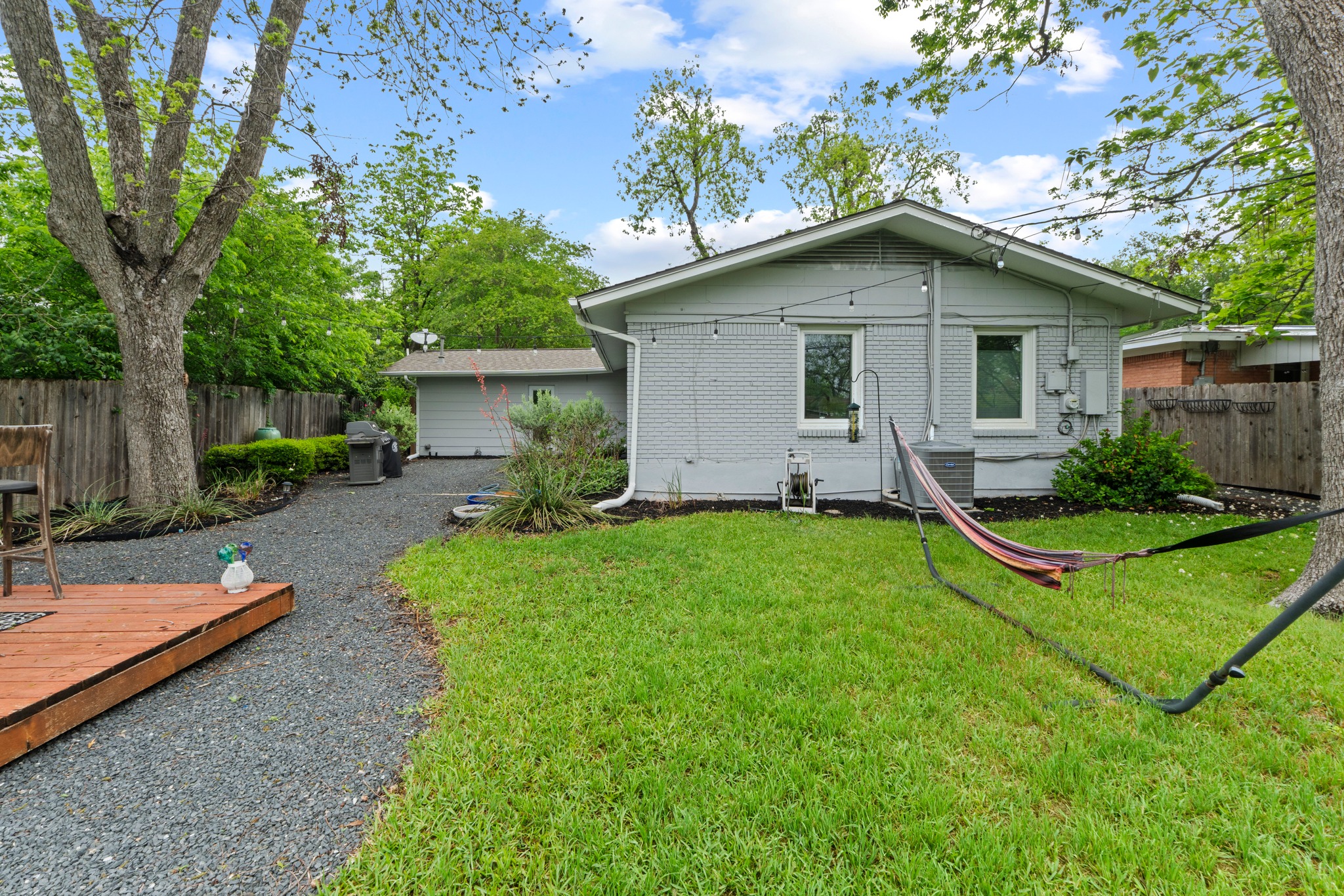 1301 Ridgemont Drive Austin, TX 78723 - Photo 30 of 32 a view of a house with backyard and garden