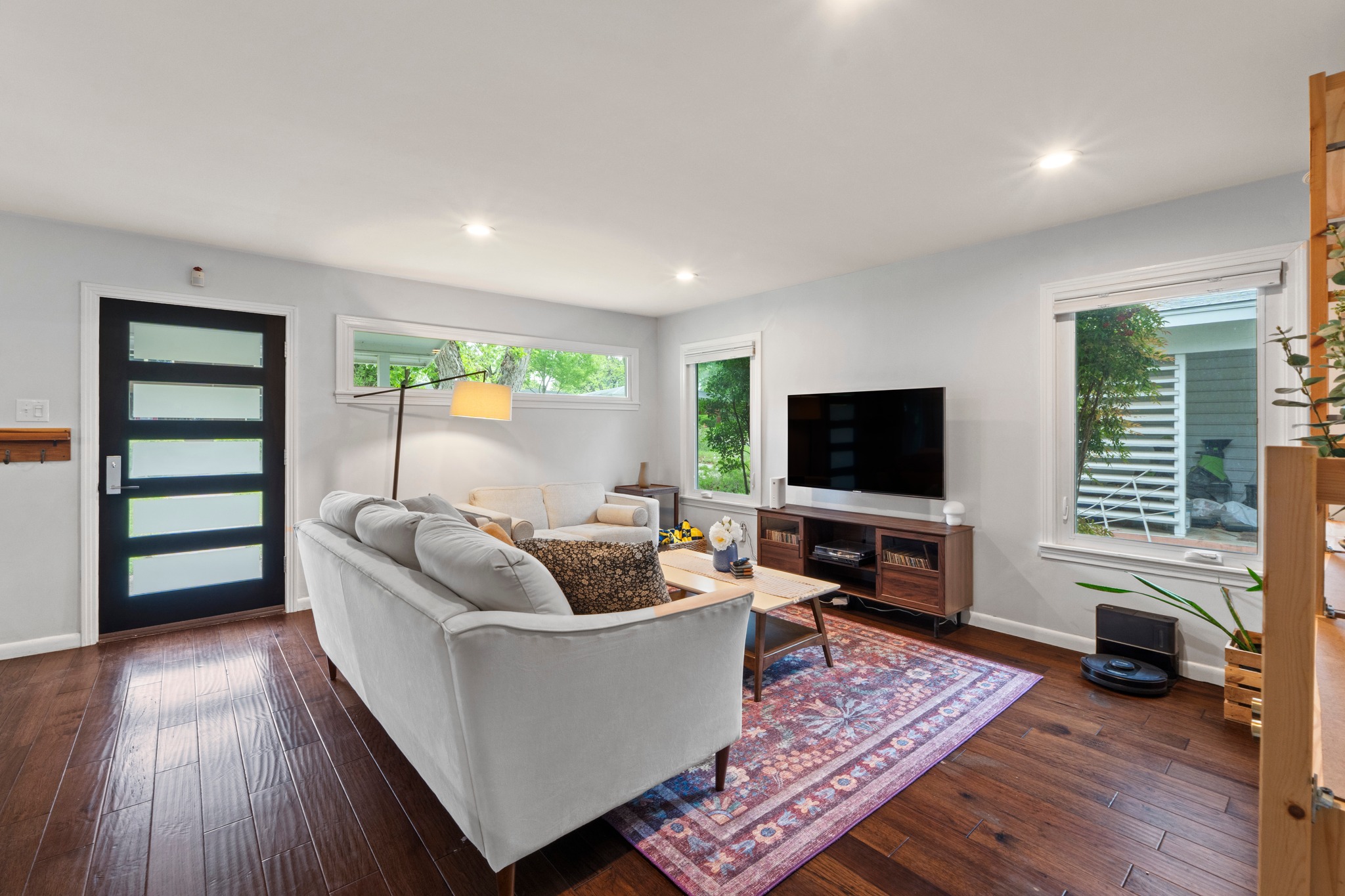 1301 Ridgemont Drive Austin, TX 78723 - Photo 10 of 32 a living room with furniture and a flat screen tv