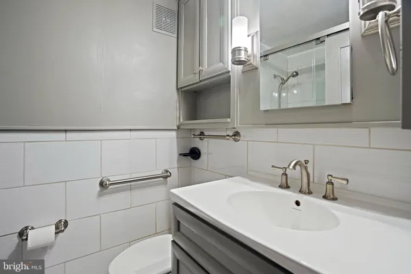 a bathroom with a sink and mirror