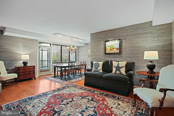 a living room with furniture and a rug