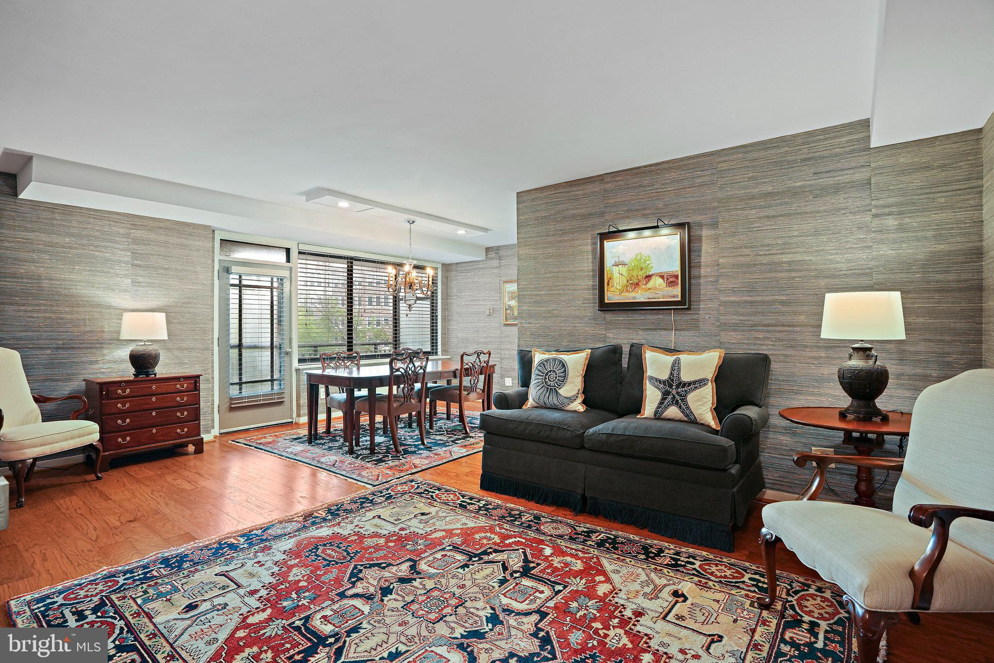 4740 Connecticut Avenue Northwest, Unit 404 Washington, DC 20008 - Photo 2 of 24 a living room with furniture and a rug