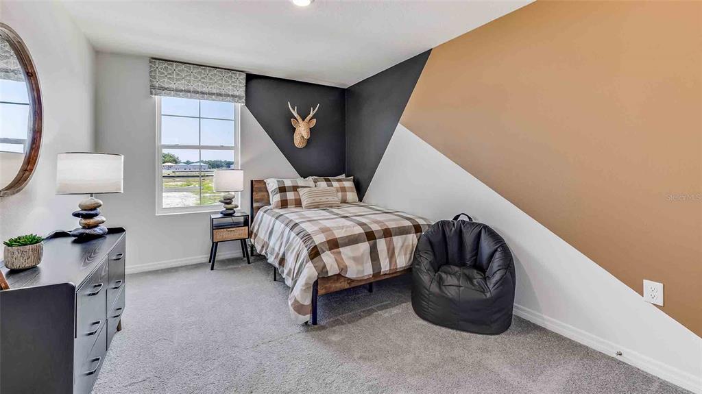 17811 Acorn Drop Road Land O Lakes, FL 34638 - Photo 6 of 11 a bedroom with a bed and a window