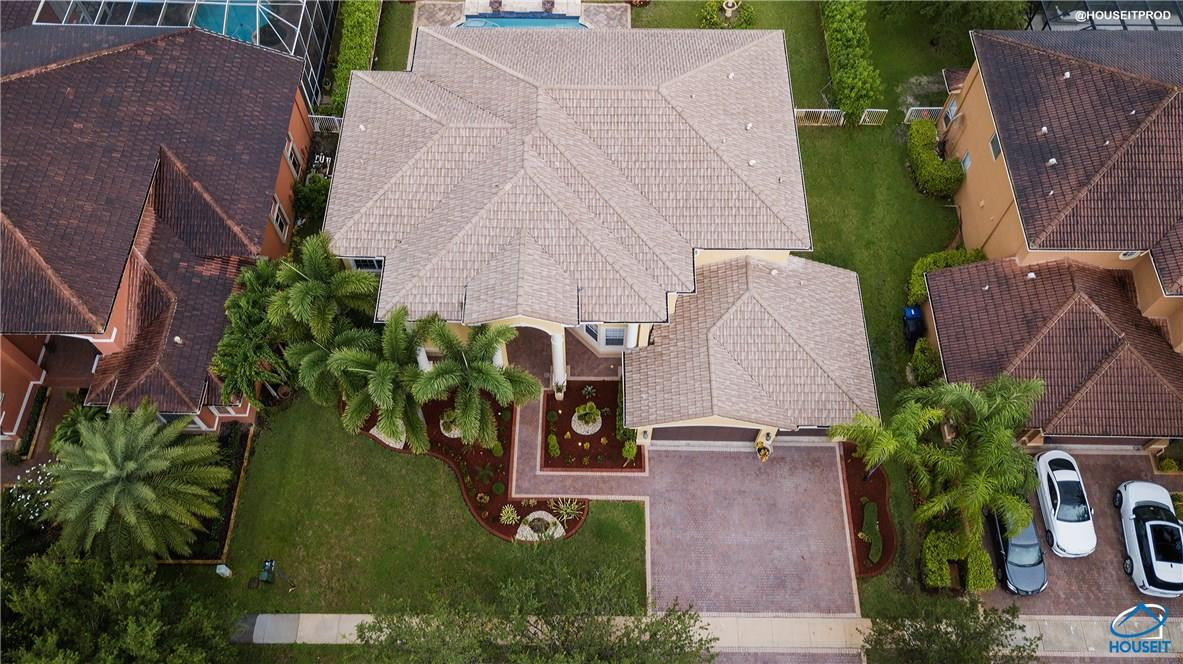 4524 Southwest 195th Way Miramar, FL 33029 - Photo 11 of 36 an aerial view of a house with a yard and garden