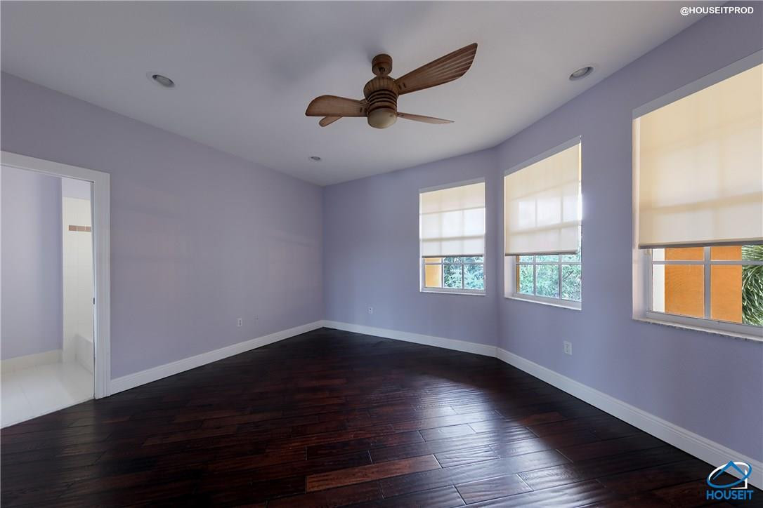 4524 Southwest 195th Way Miramar, FL 33029 - Photo 19 of 36 a view of empty room with wooden floor and fan