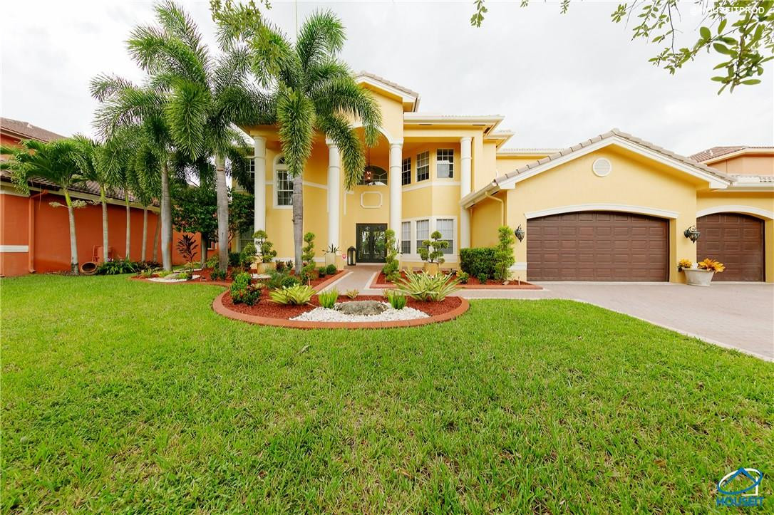 4524 Southwest 195th Way Miramar, FL 33029 - Photo 2 of 36 a view of a house with a swimming pool and a yard