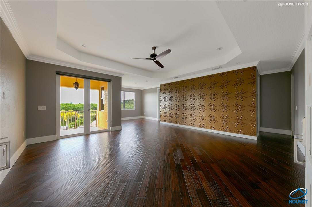 4524 Southwest 195th Way Miramar, FL 33029 - Photo 21 of 36 a view of an empty room with wooden floor and a window