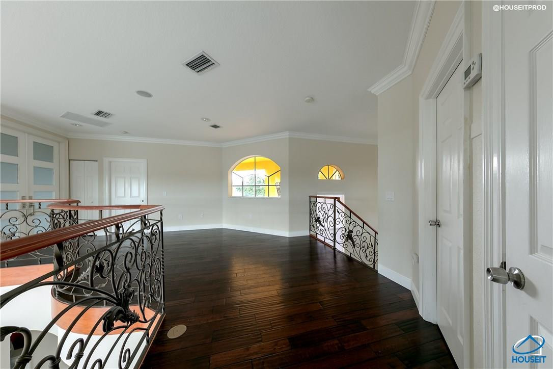 4524 Southwest 195th Way Miramar, FL 33029 - Photo 27 of 36 a view of entryway and hall with wooden floor