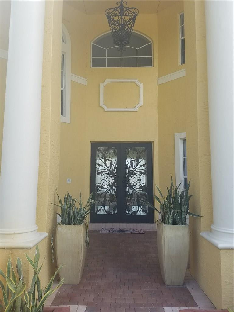4524 Southwest 195th Way Miramar, FL 33029 - Photo 3 of 36 a view of an entryway with a potted plant