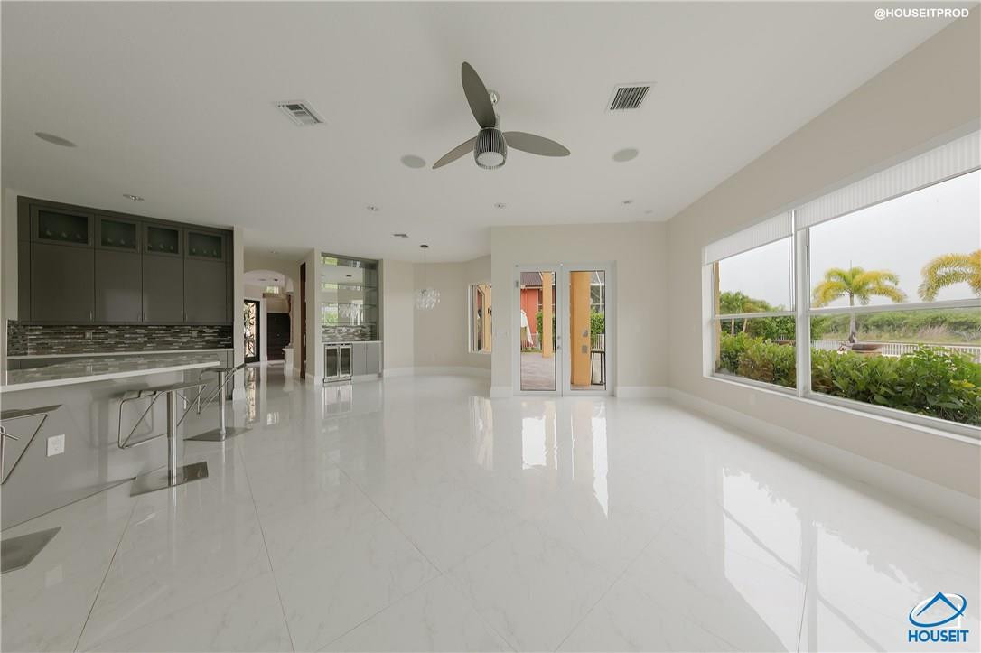 4524 Southwest 195th Way Miramar, FL 33029 - Photo 32 of 36 a living room with furniture and a flat screen tv