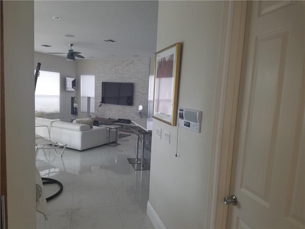 4524 Southwest 195th Way Miramar, FL 33029 - Photo 36 of 36 a living room with furniture and a flat screen tv