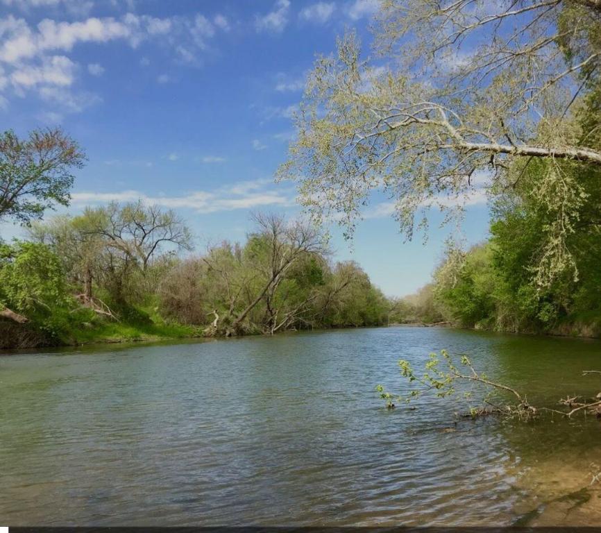 450 Riverside Drive Bastrop, TX 78602 - Photo 4 of 5 a view of a lake with a mountain in the background