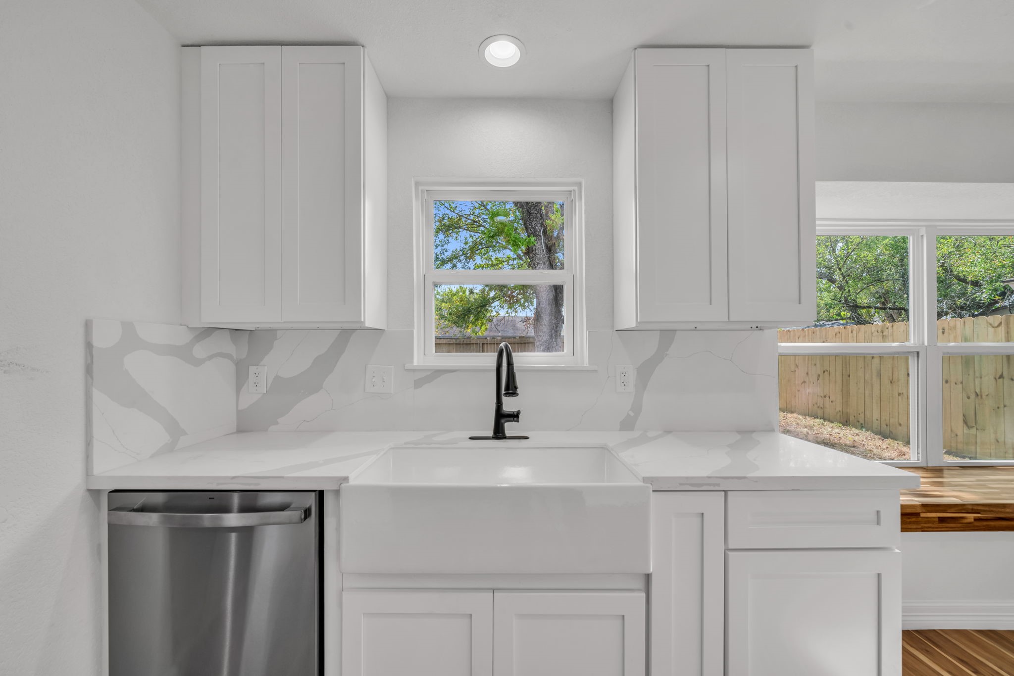 12426 Enchanted Path Drive Houston, TX 77044 - Photo 13 of 28 a kitchen with a sink cabinets and window