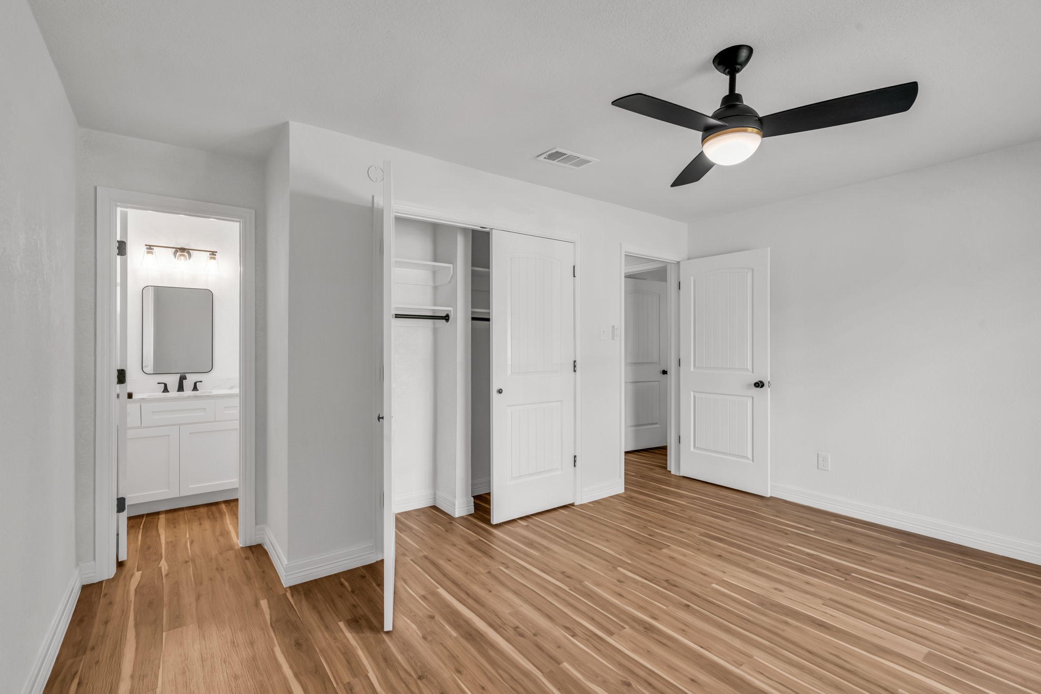 12426 Enchanted Path Drive Houston, TX 77044 - Photo 16 of 28 a view of empty room with wooden floor