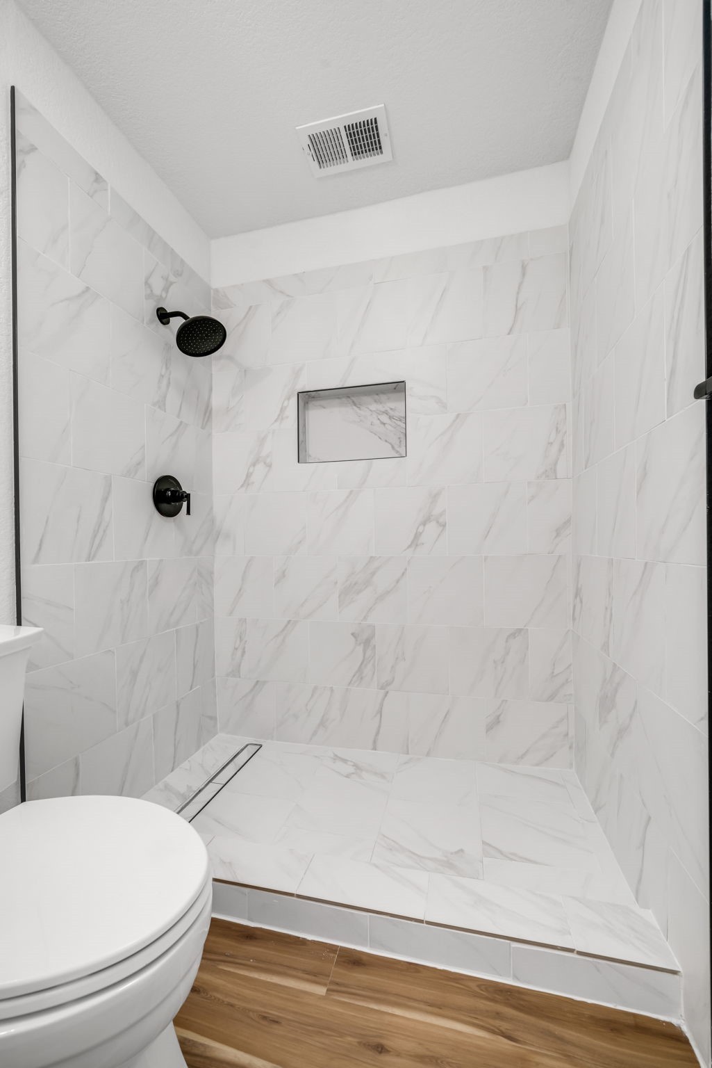 12426 Enchanted Path Drive Houston, TX 77044 - Photo 19 of 28 a bathroom with a toilet and a shower