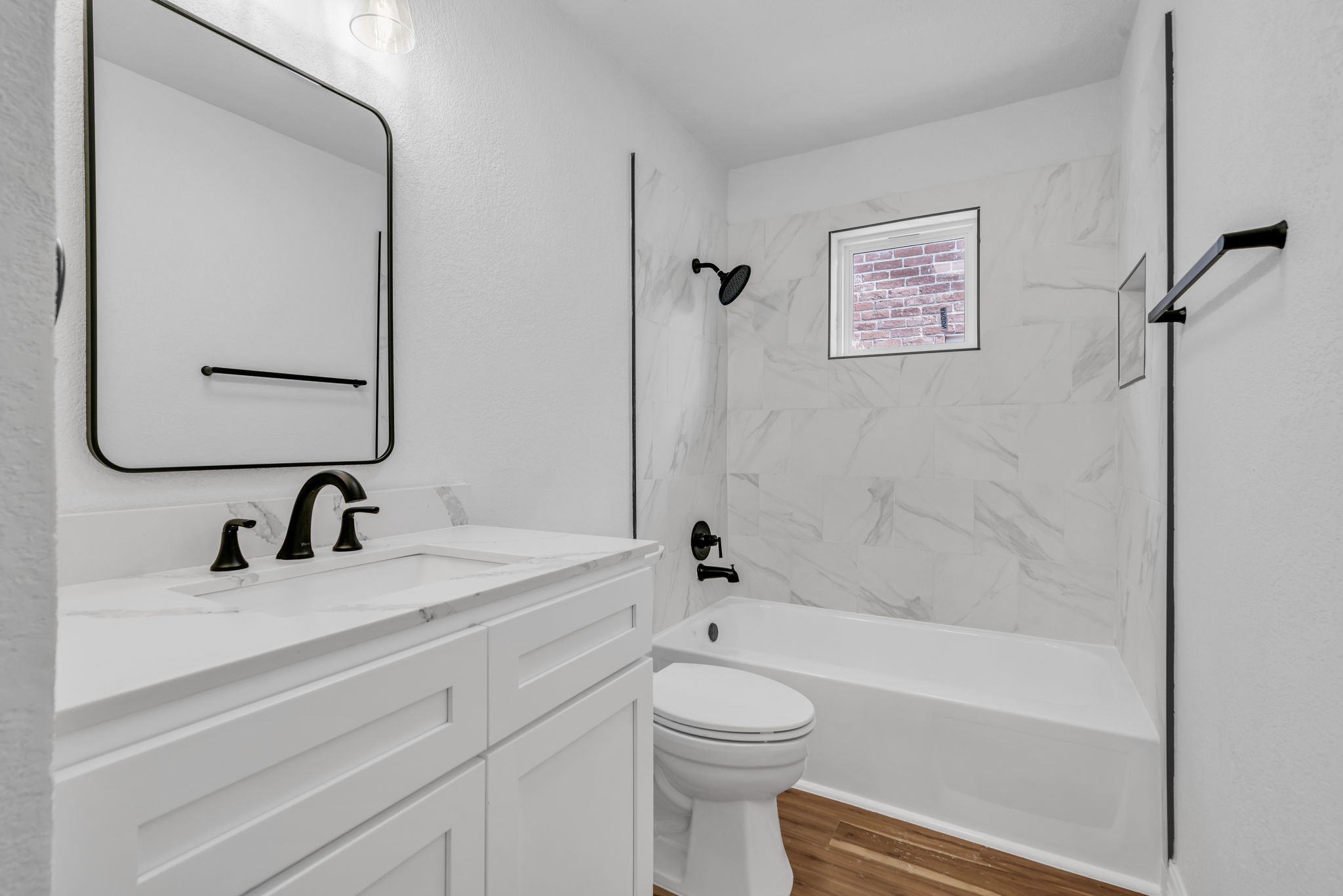 12426 Enchanted Path Drive Houston, TX 77044 - Photo 24 of 28 a bathroom with a granite countertop sink toilet and shower