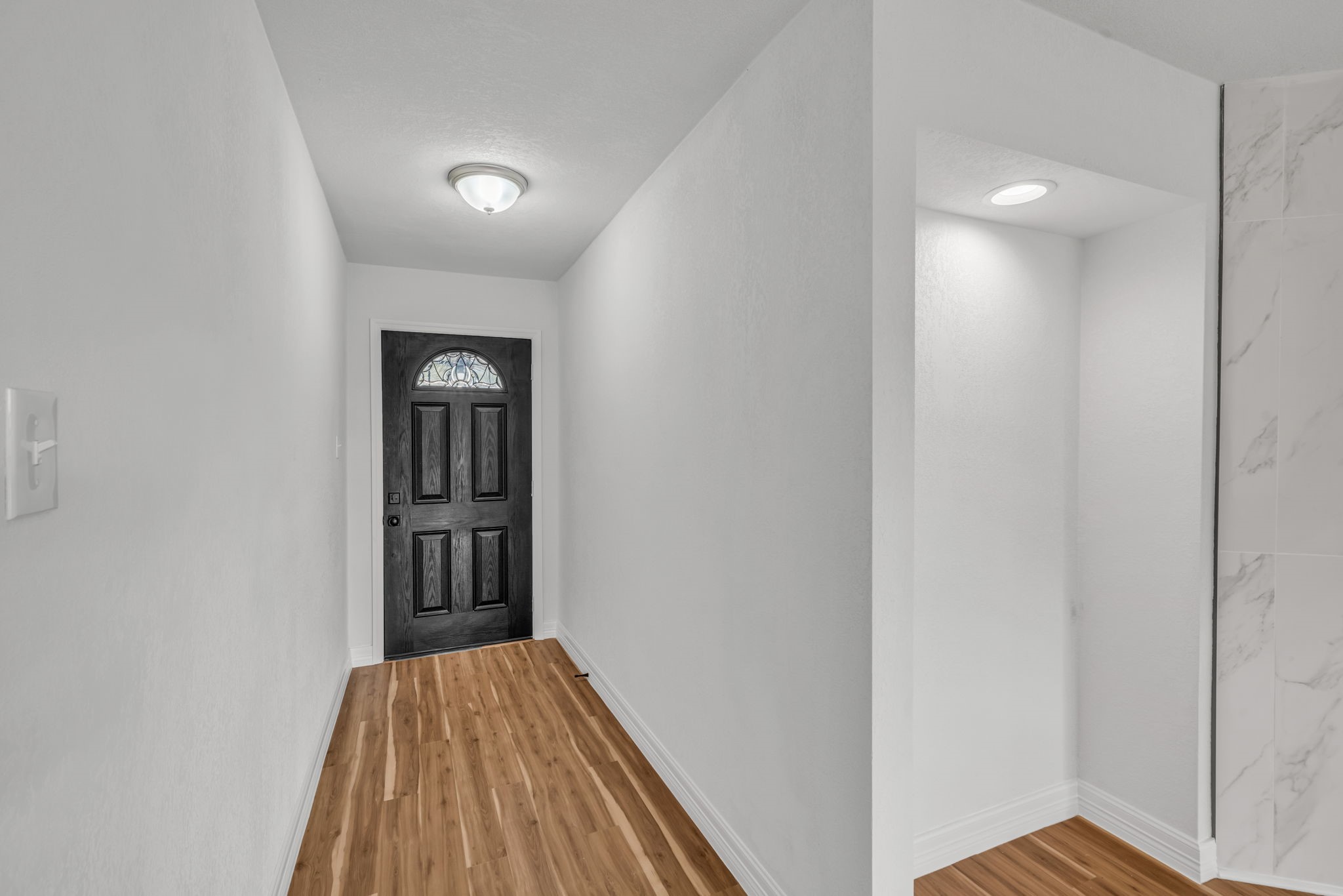 12426 Enchanted Path Drive Houston, TX 77044 - Photo 26 of 28 a view of hallway with wooden floor