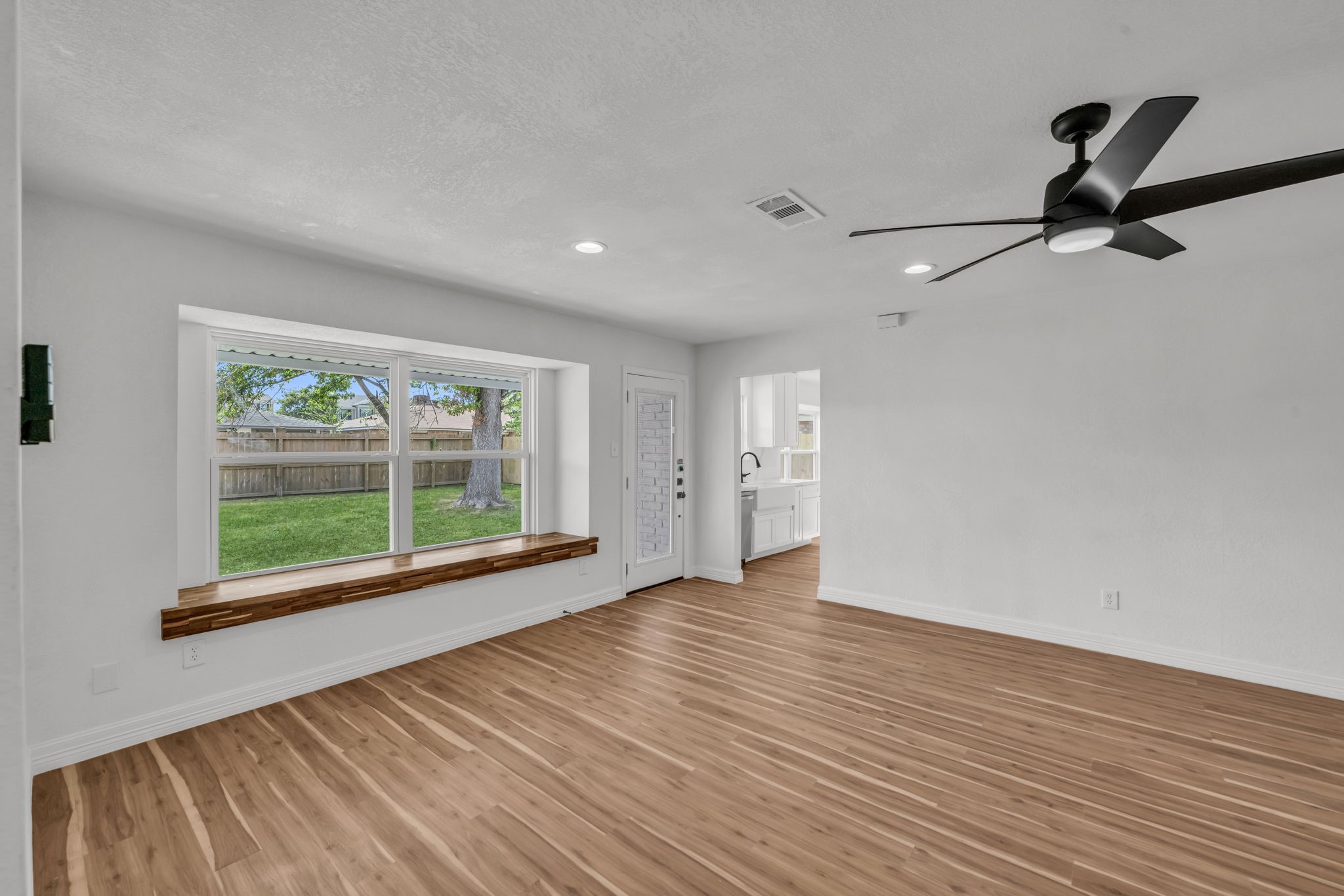 12426 Enchanted Path Drive Houston, TX 77044 - Photo 10 of 28 a view of room with window and wooden floor