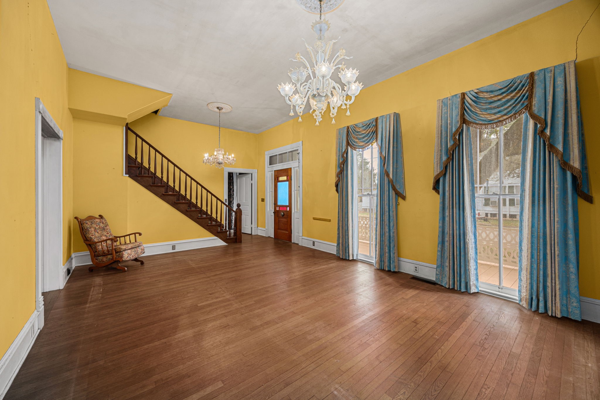 236 Preston Street Columbus, TX 78934 - Photo 12 of 50 a view of a hallway with wooden floor and staircase