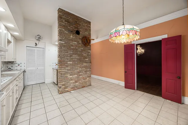 a view of a hallway with chandelier