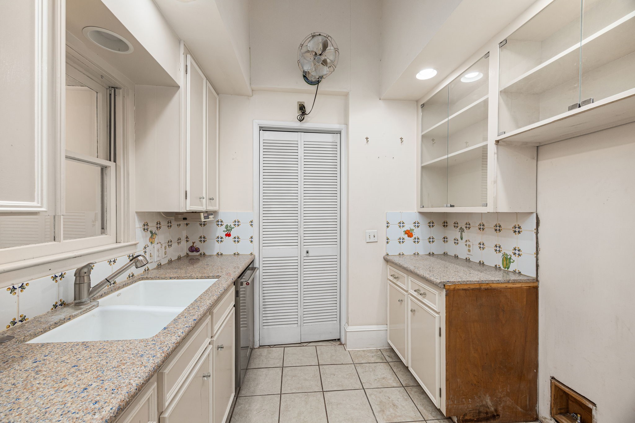 236 Preston Street Columbus, TX 78934 - Photo 18 of 50 a bathroom with a granite countertop sink a toilet a mirror and vanity