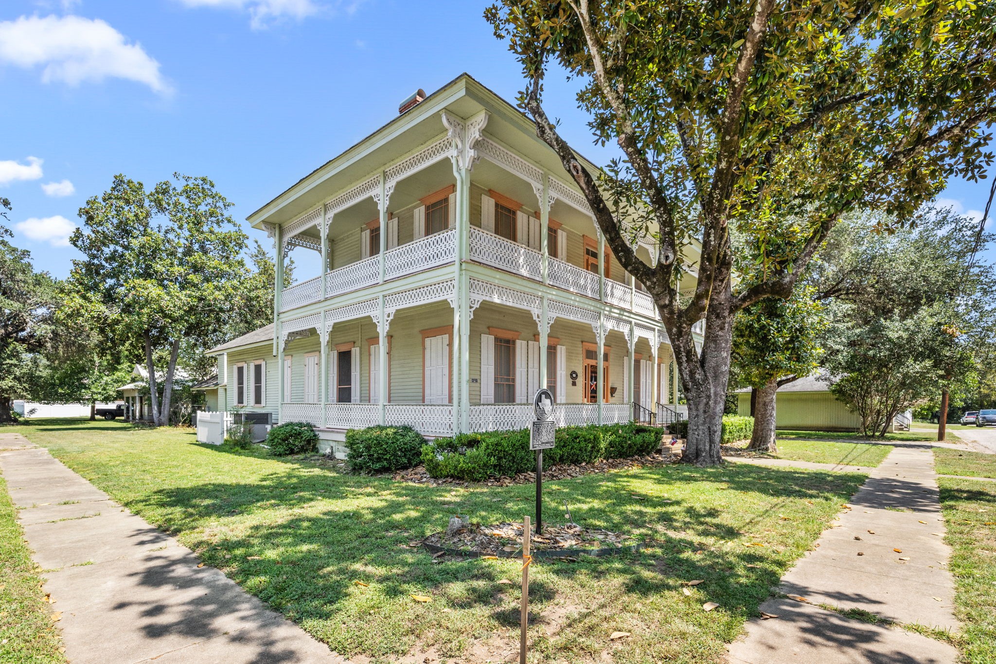 236 Preston Street Columbus, TX 78934 - Photo 2 of 50 a front view of a house with a yard