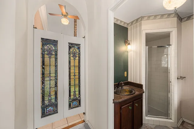 a view of a bathroom with a sink and mirror