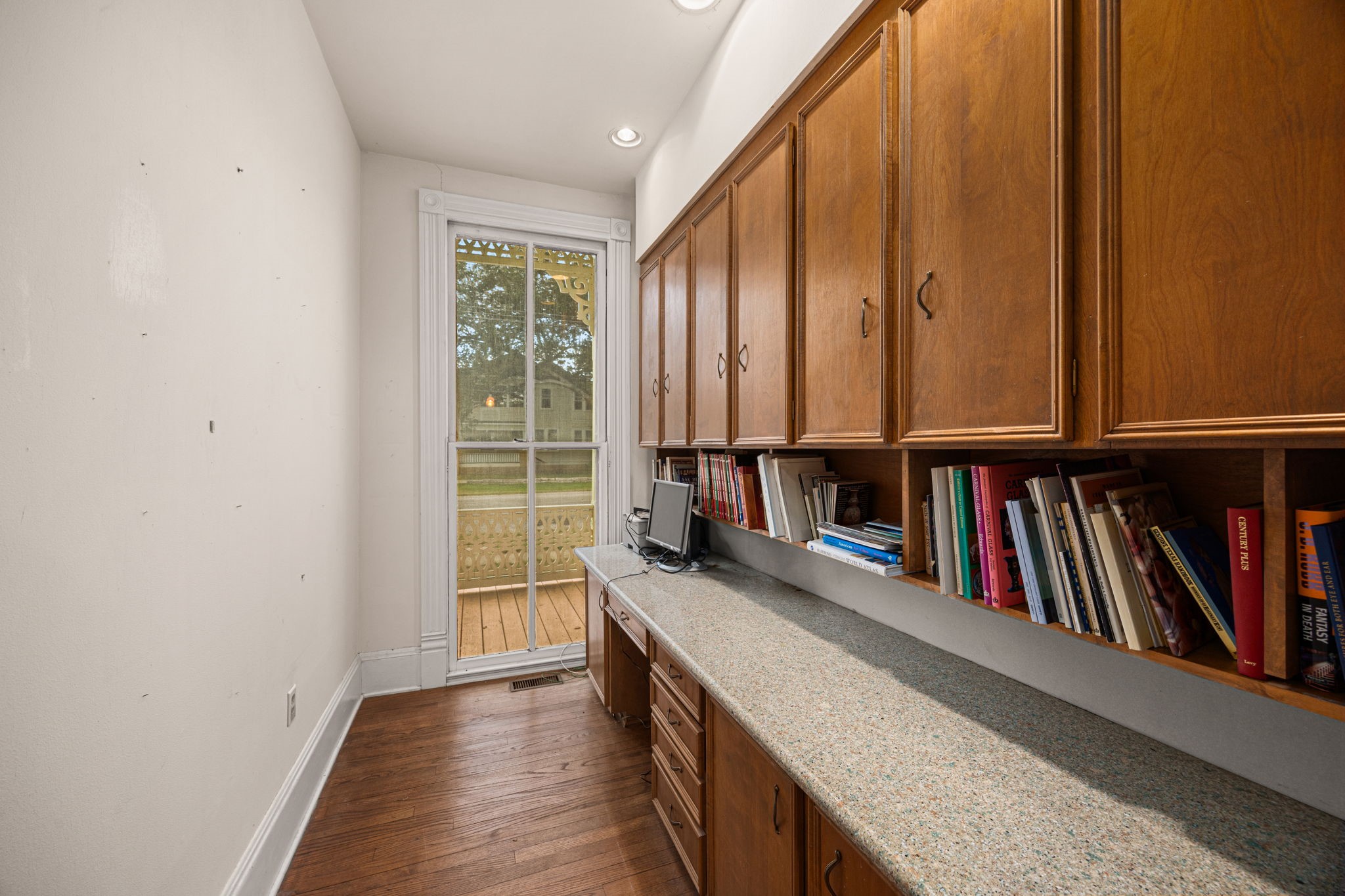 236 Preston Street Columbus, TX 78934 - Photo 25 of 50 a view of a book shelf and wooden floor