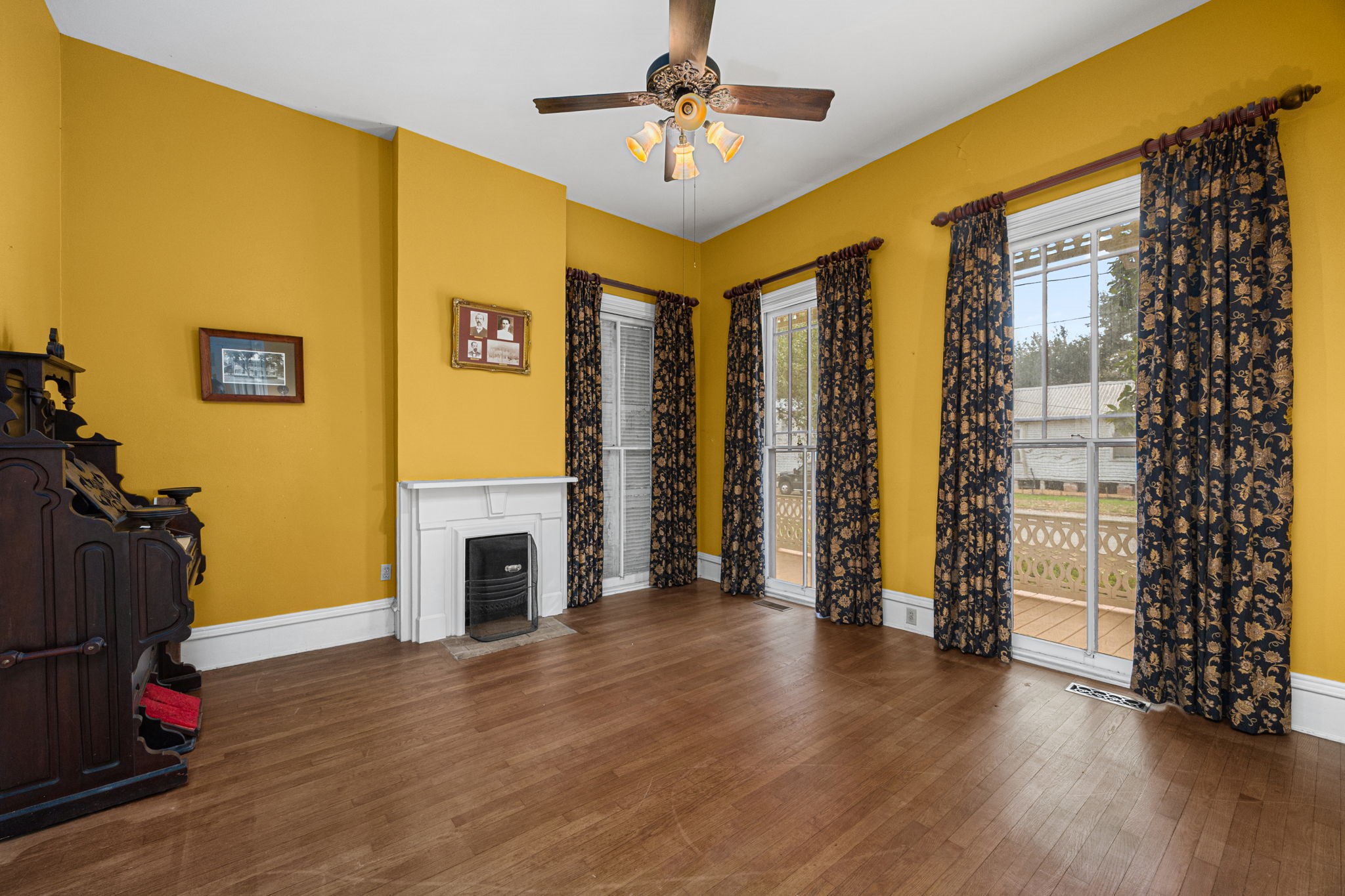 236 Preston Street Columbus, TX 78934 - Photo 26 of 50 a view of a livingroom with wooden floor and a ceiling fan