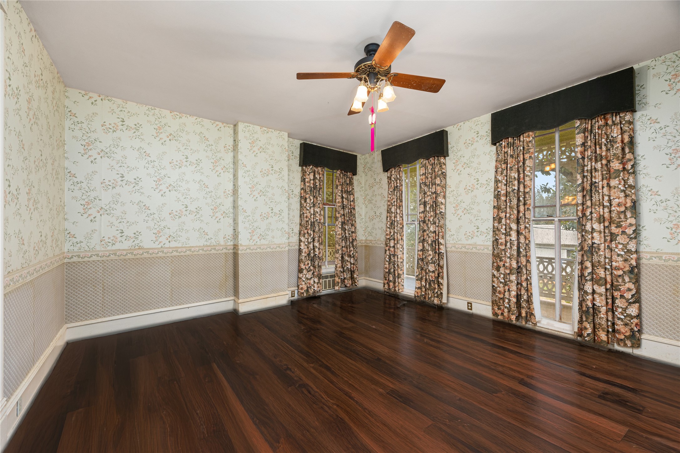 236 Preston Street Columbus, TX 78934 - Photo 35 of 50 a view of an empty room with wooden floor and a window