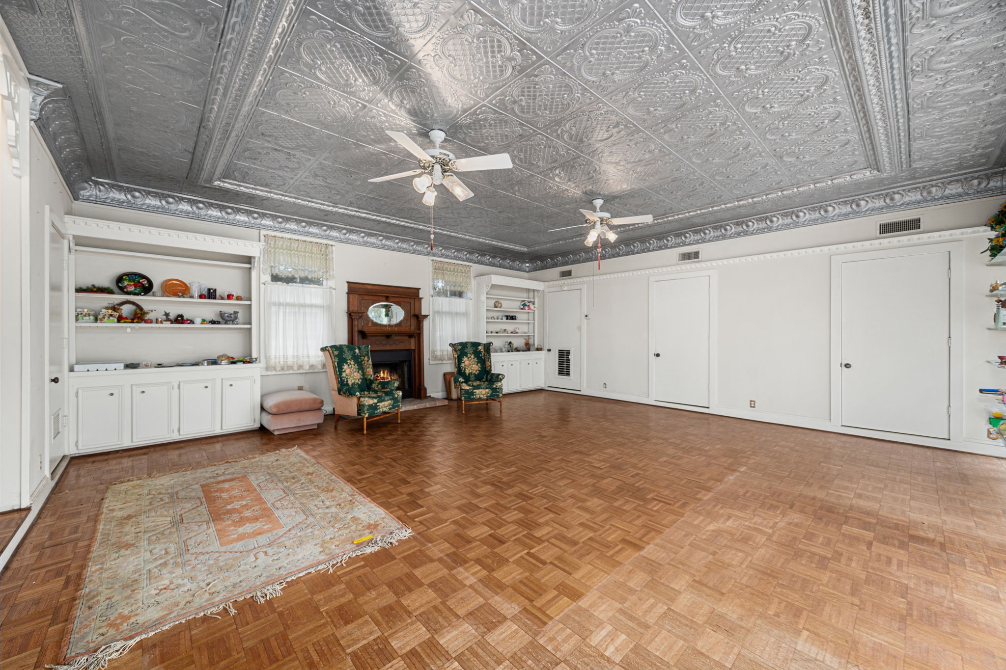 236 Preston Street Columbus, TX 78934 - Photo 38 of 50 a view of a livingroom with hardwood floor and a ceiling fan