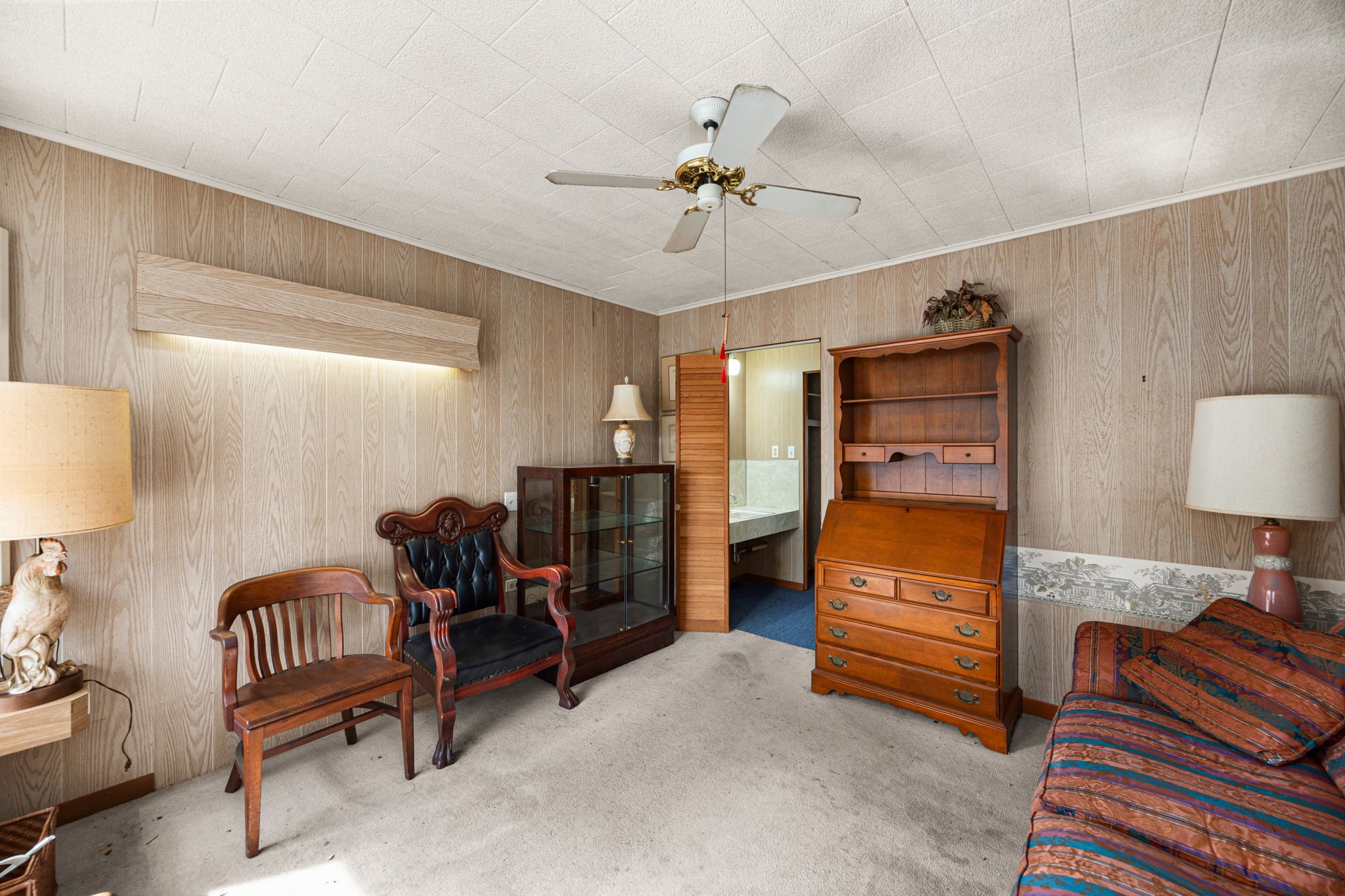 236 Preston Street Columbus, TX 78934 - Photo 47 of 50 a bedroom with furniture and a lamp