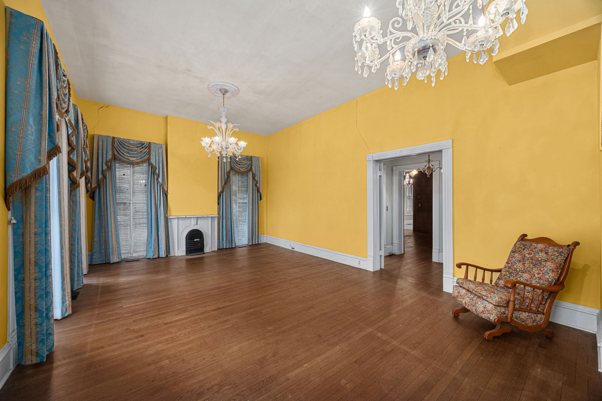 236 Preston Street Columbus, TX 78934 - Photo 9 of 50 a view of a livingroom with furniture a chandelier and wooden floor