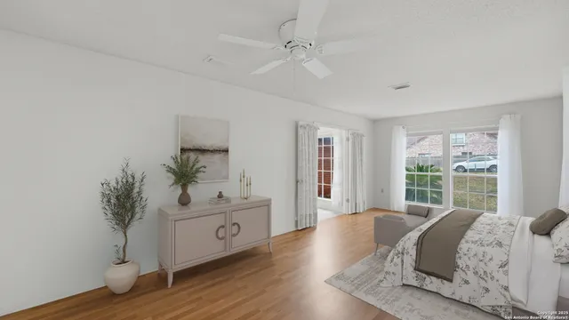 a bed room with a bed and a large window