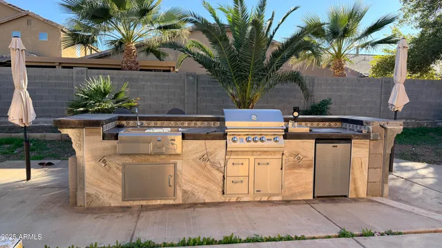 a white house with tree in front of it